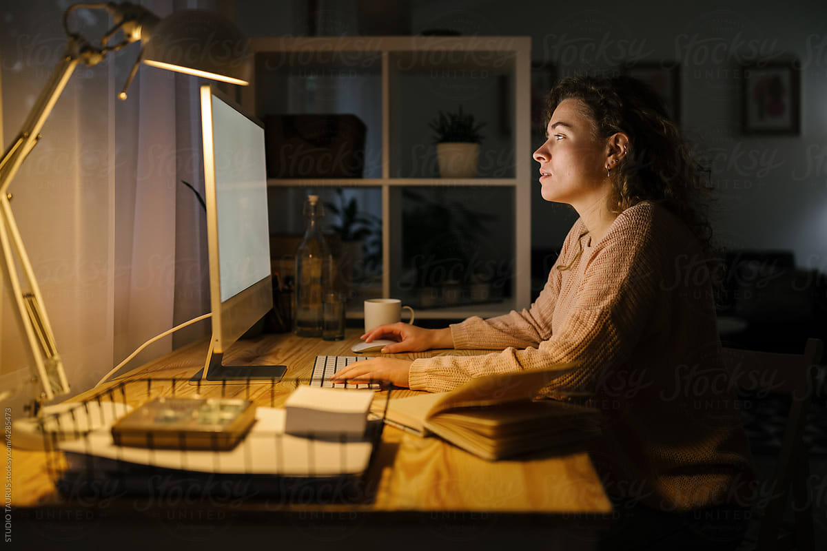 Freelancer woman working from home during night