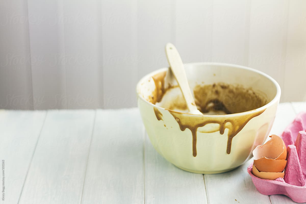 Messy Mixing Bowl With Chocolate Cake Batter Dripping Down The O By Stocksy Contributor