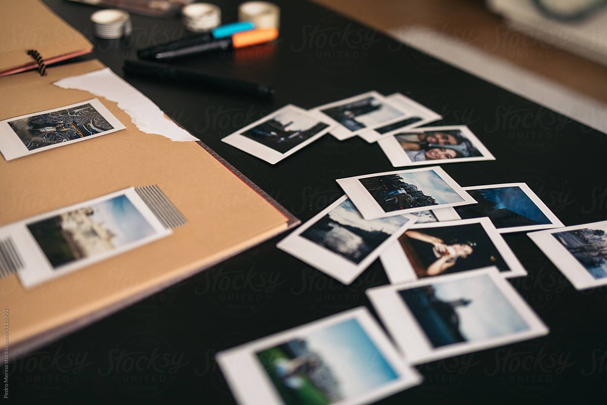 Scrapbook With Polaroid Photos by Stocksy Contributor Pedro Merino -  Stocksy