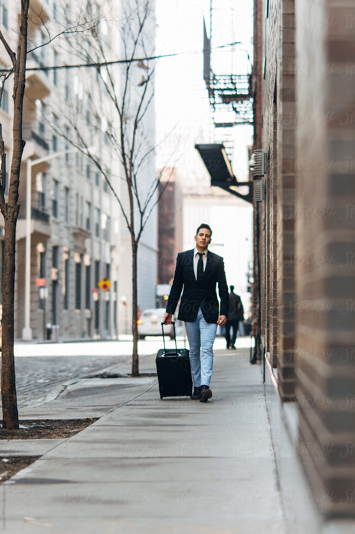 Stylish Mexican Businessman With Suitcase In the City