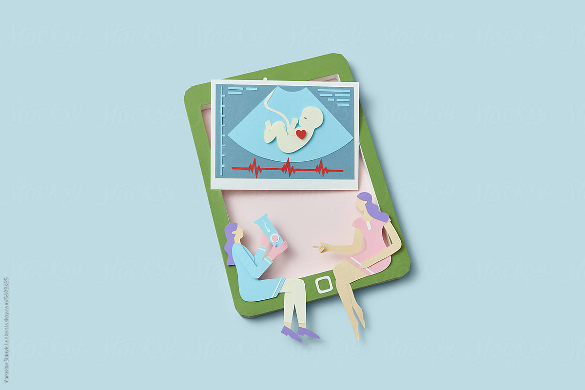 Papercraft two women sitting on tablet with ultrasound baby scan