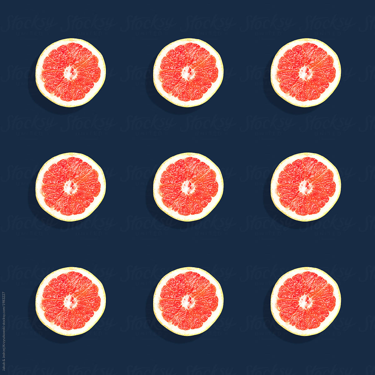 Pattern made of 9 Grapefruits on Dark Navy Background