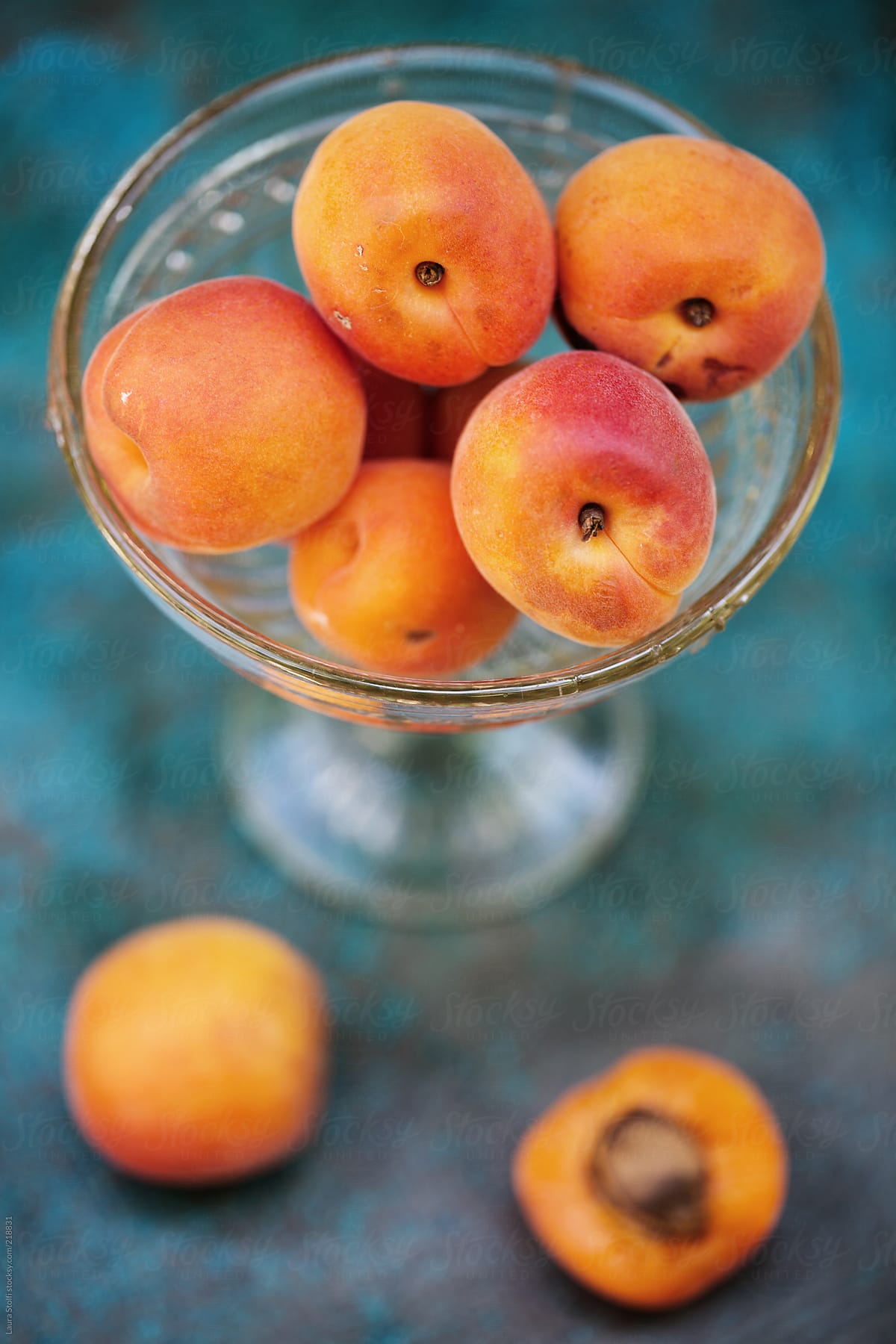 Overhead shot of ripe organic apricots in crystal bowl