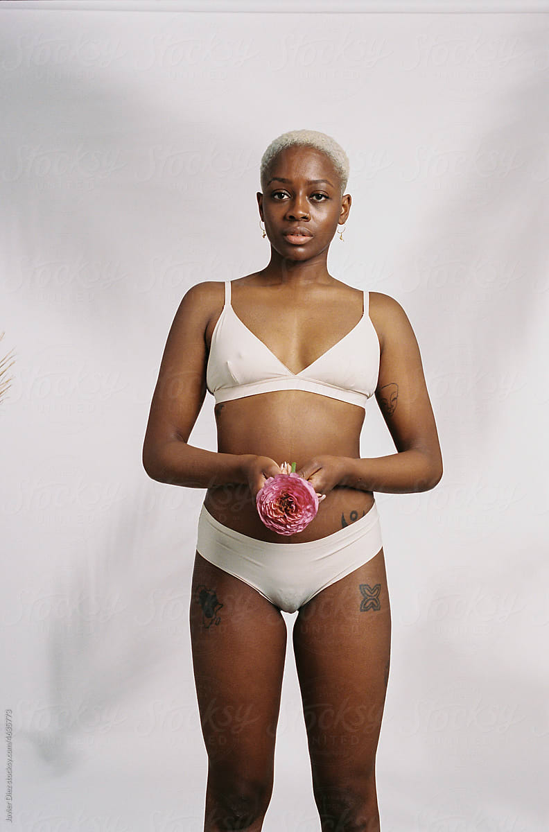 Confident Black Woman In Bikini by Stocksy Contributor Javier