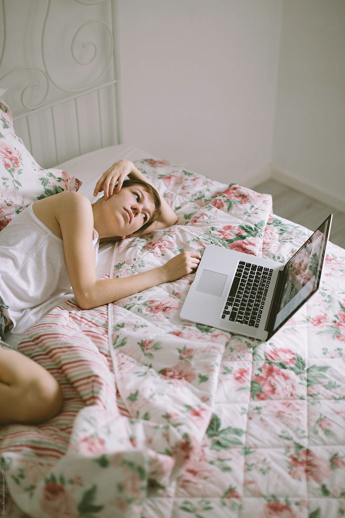young woman relax with laptop on the bed