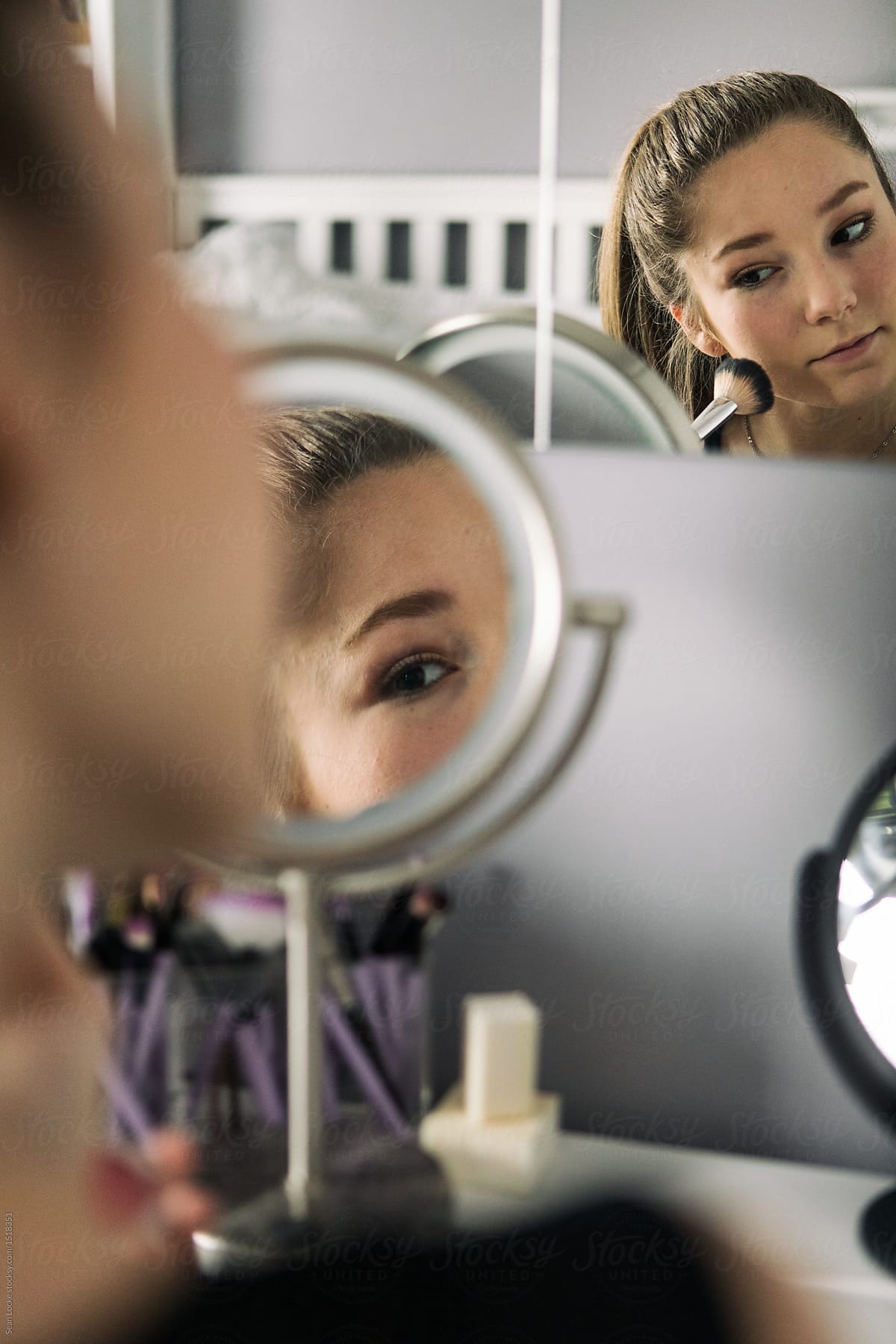 Teenager: Girl Applies Blush Using Makeup Brush