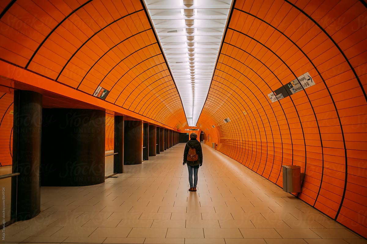Woman standing in underground subway station