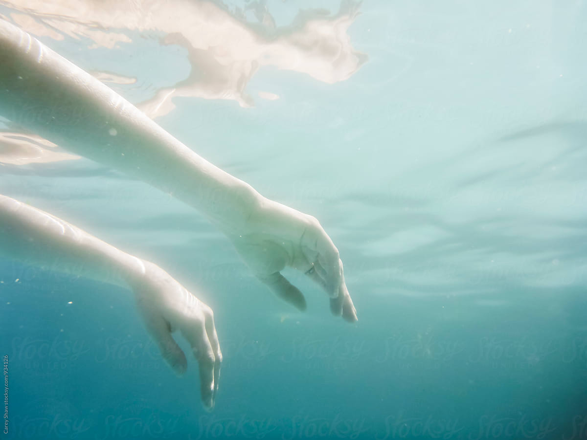 Underwater view of woman floating in pool
