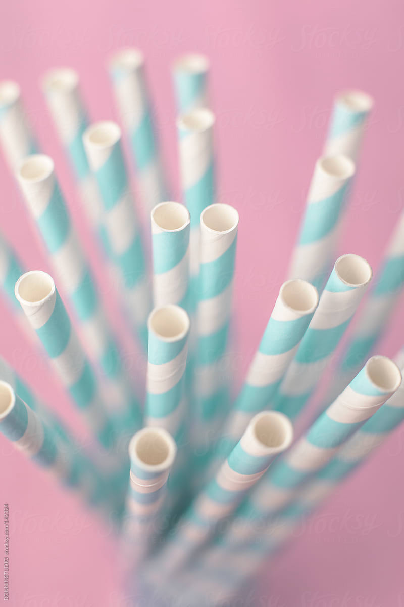 Close up of straws over pink background. Pastel tones.