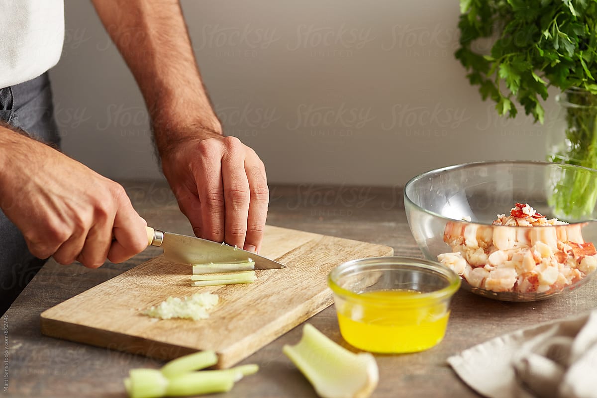 Man cutting celery for lobster roll