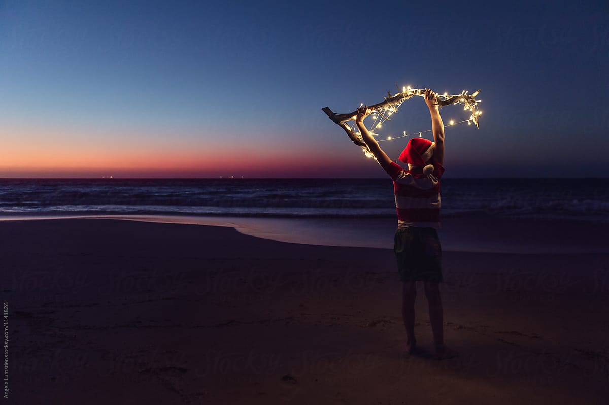 Playing with Christmas lights at the beach after sunset