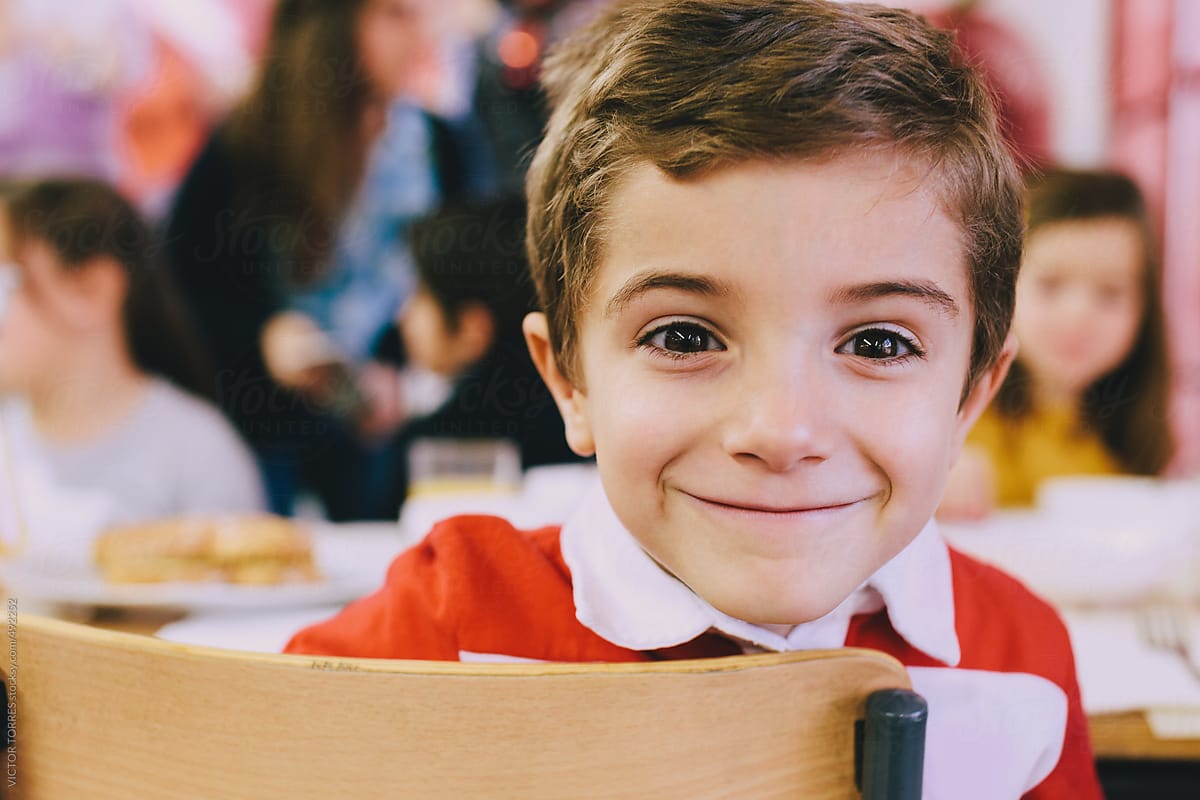Kindergarten Kids Eating At School Canteen by Stocksy Contributor VICTOR  TORRES - Stocksy