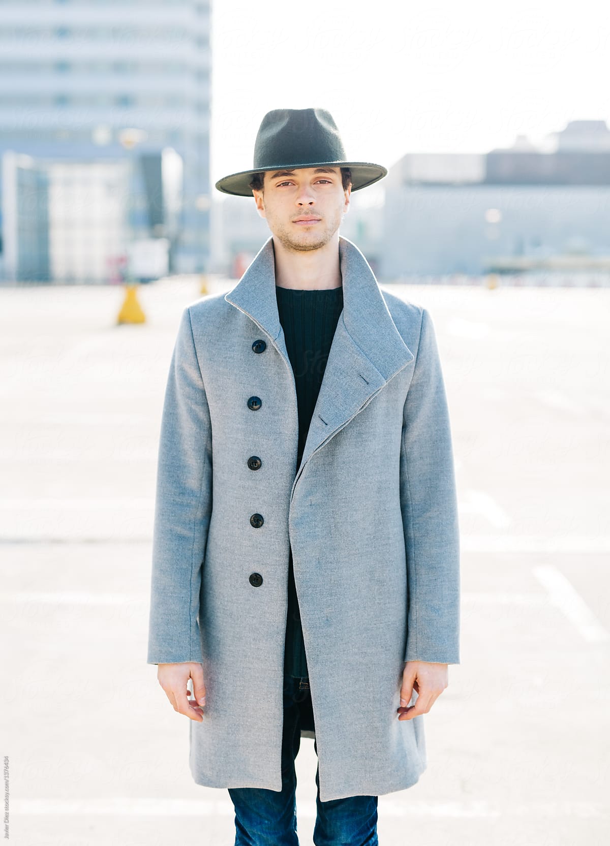 Young man wearing stylish coat