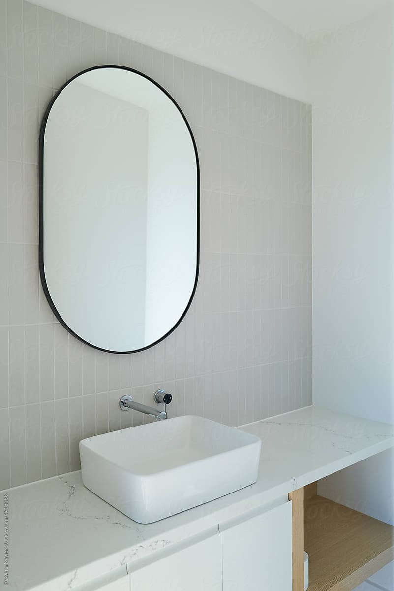 Bathroom with oval mirror