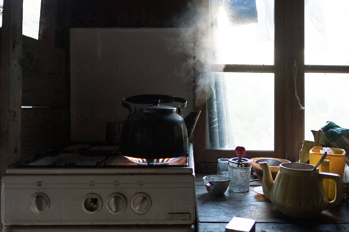 old kettle on the gas stove in a rustic kitchen