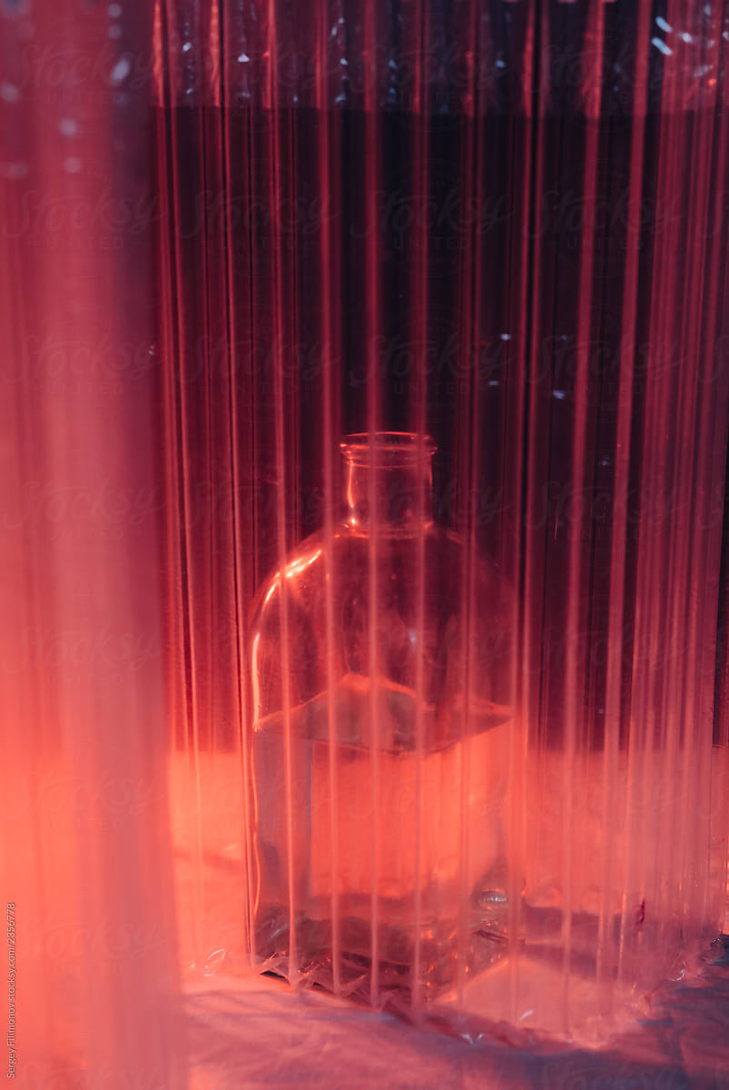 Bottle behind transparent barrier