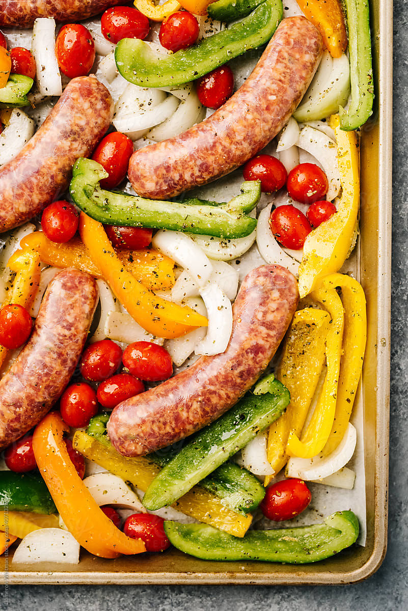 Roasting sheet pan veggies with sausage
