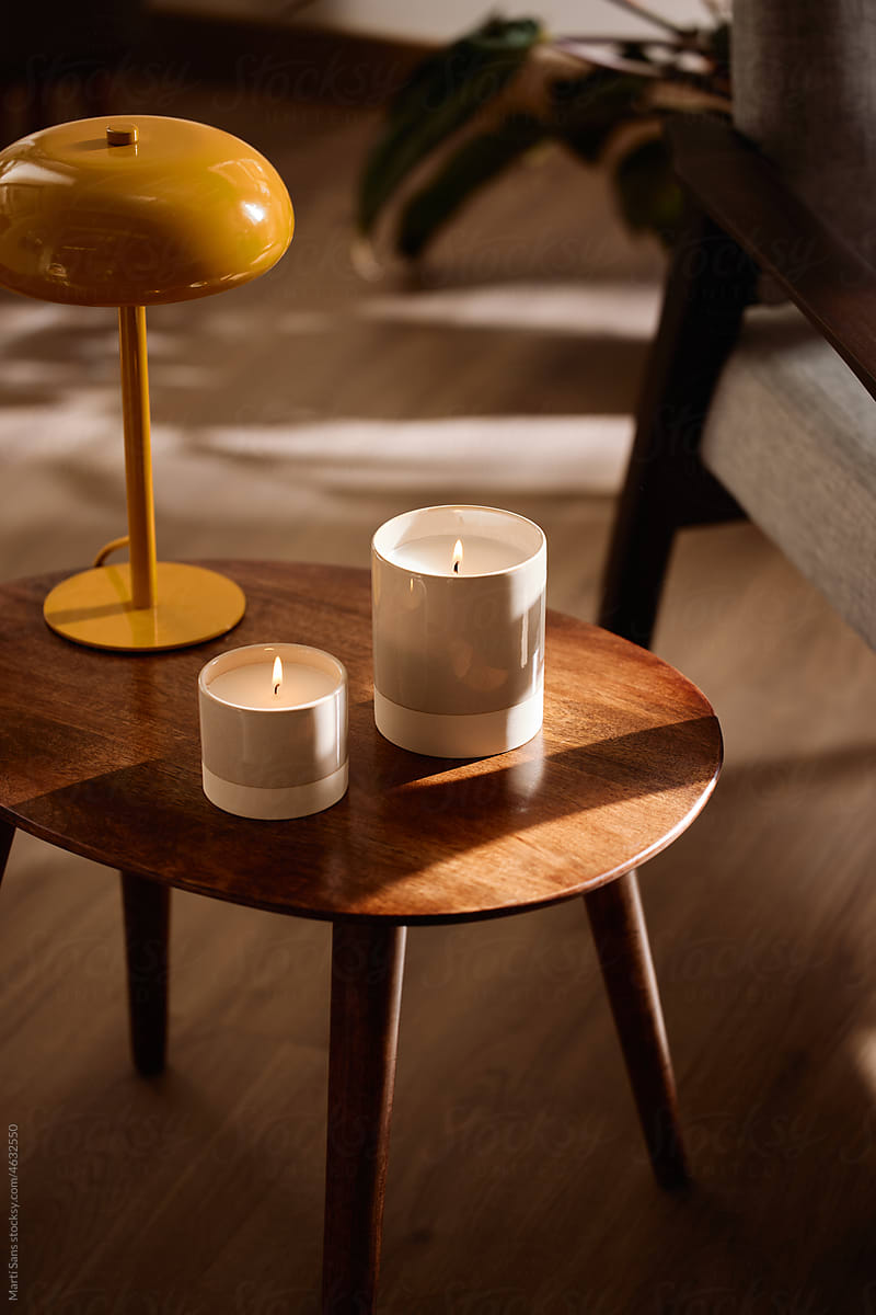 Table with candles and lamp