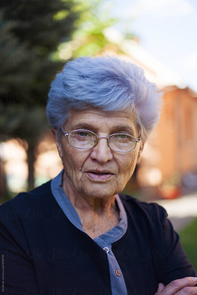 Portrait Of An Old Woman With Grey Hair By Veavea Stocksy United