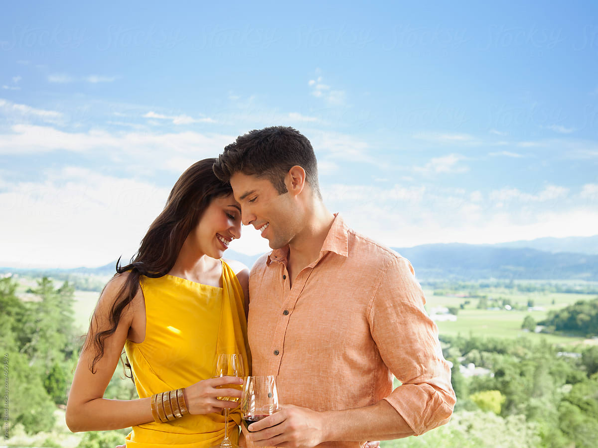 Portrait of couple traveling and drinking wine on vacation in Napa