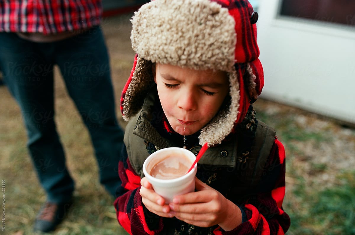 boy drinking too hot cocoa