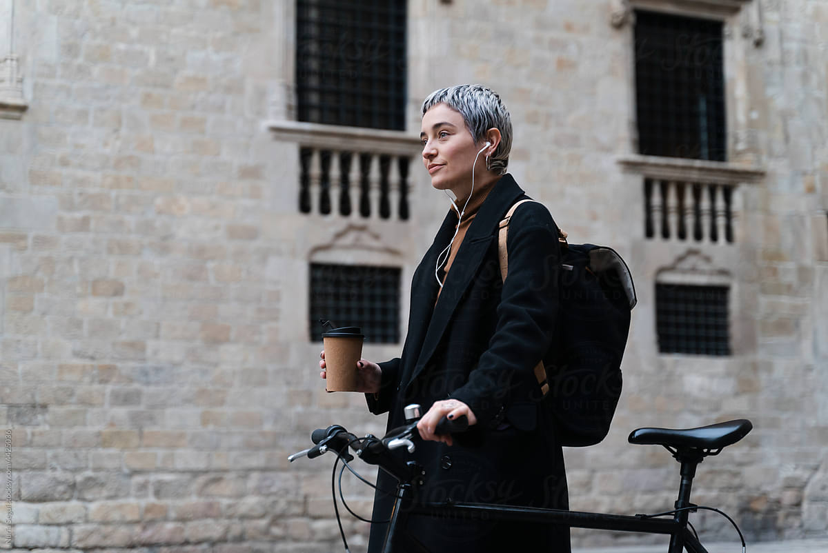 Female Bicyclist Using Headphones
