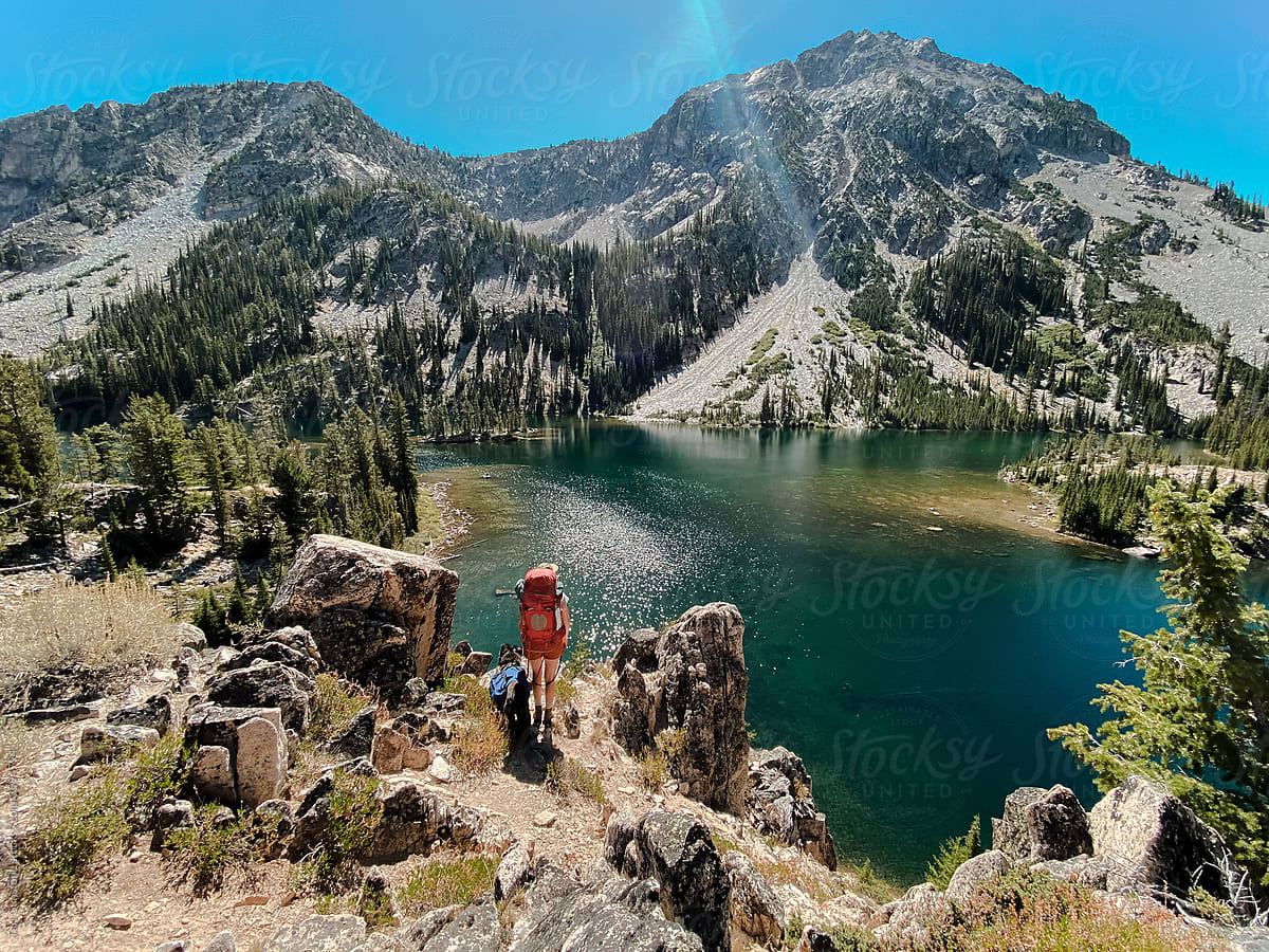 Backpacker overlooking lake