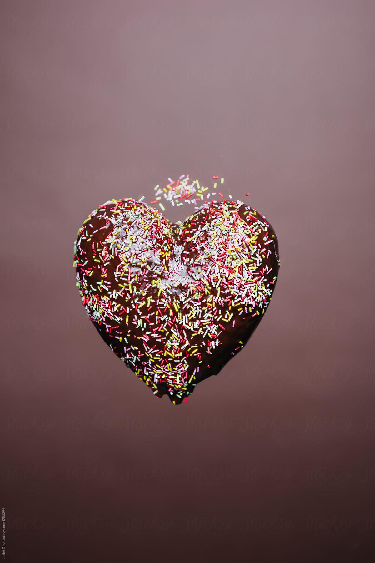 Chocolate heart with colorful sprinkles