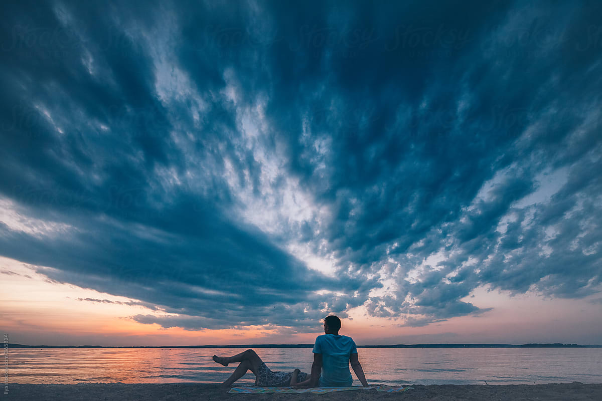 Young couple outdoors summer nature relax beach sunset