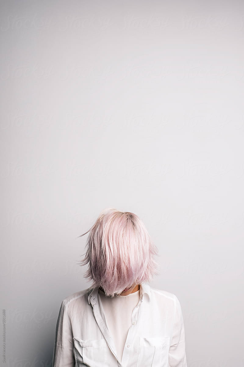 Pink-haired girl with covered face.