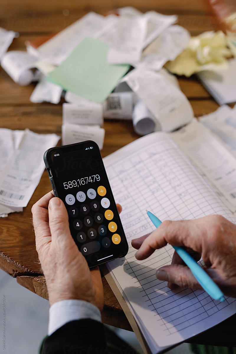 Businessman Using Calculator App for Finance Work