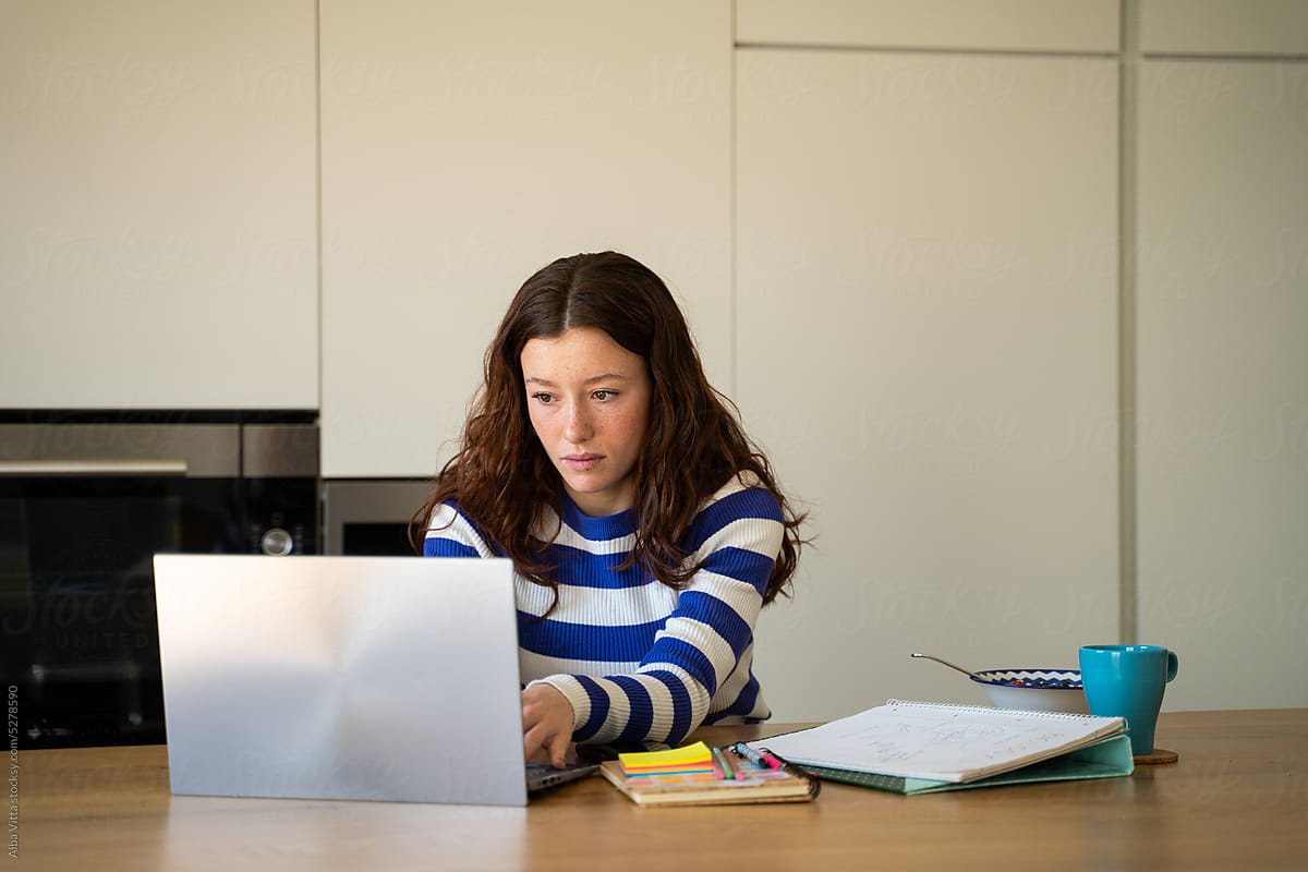 woman using laptop to study