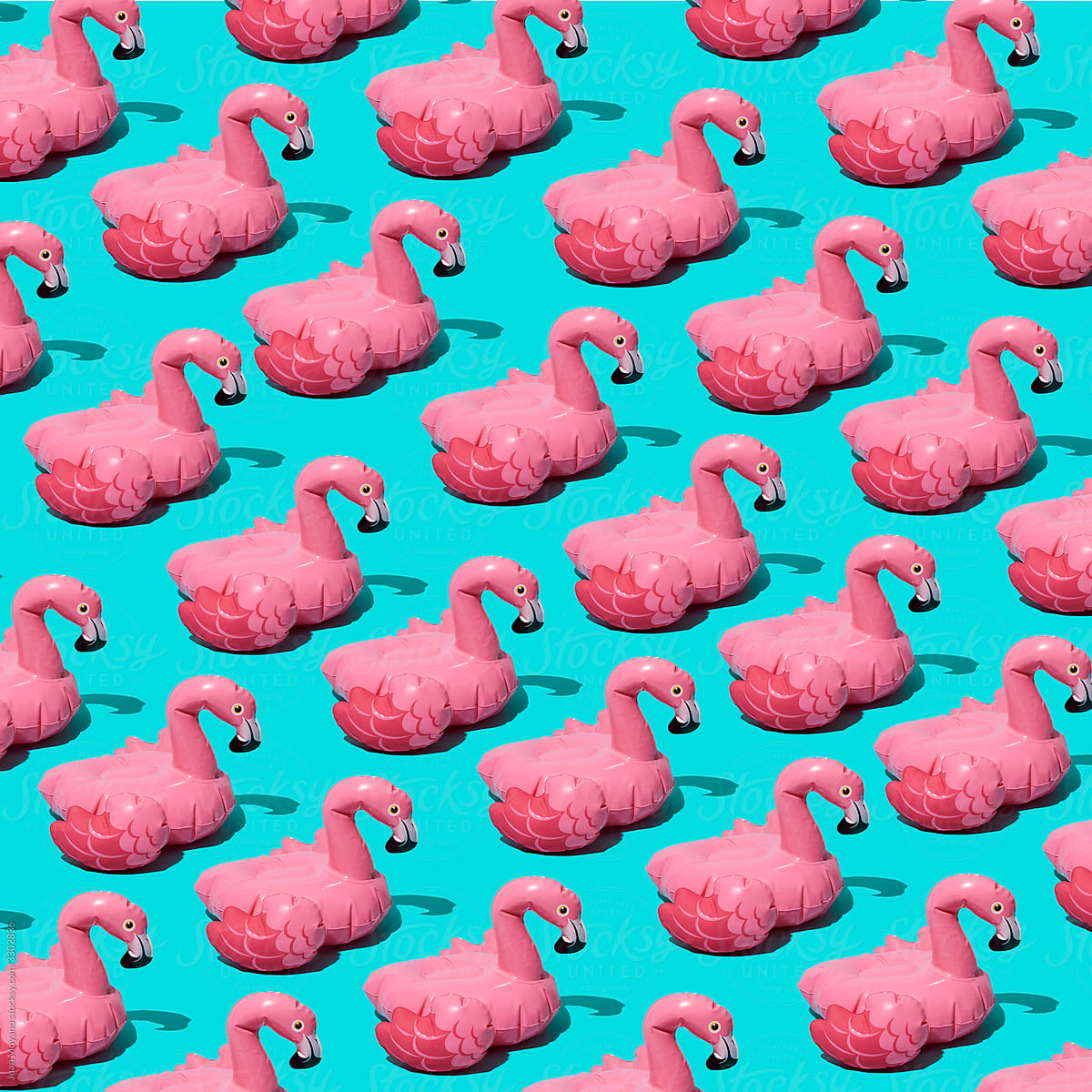 mosaic of pink flamingo-shaped floaties