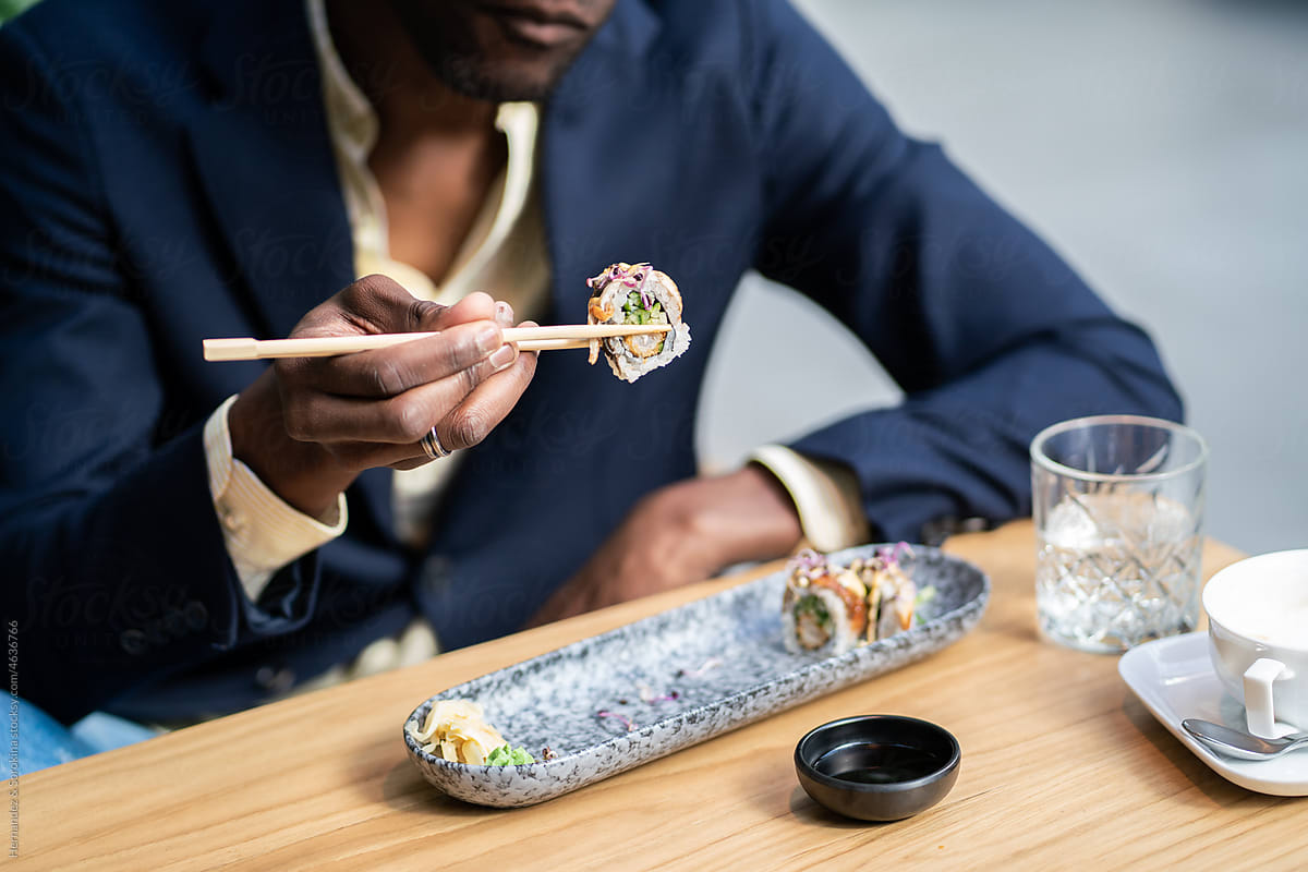 Anonymous Man Eating Sushi For Lunch