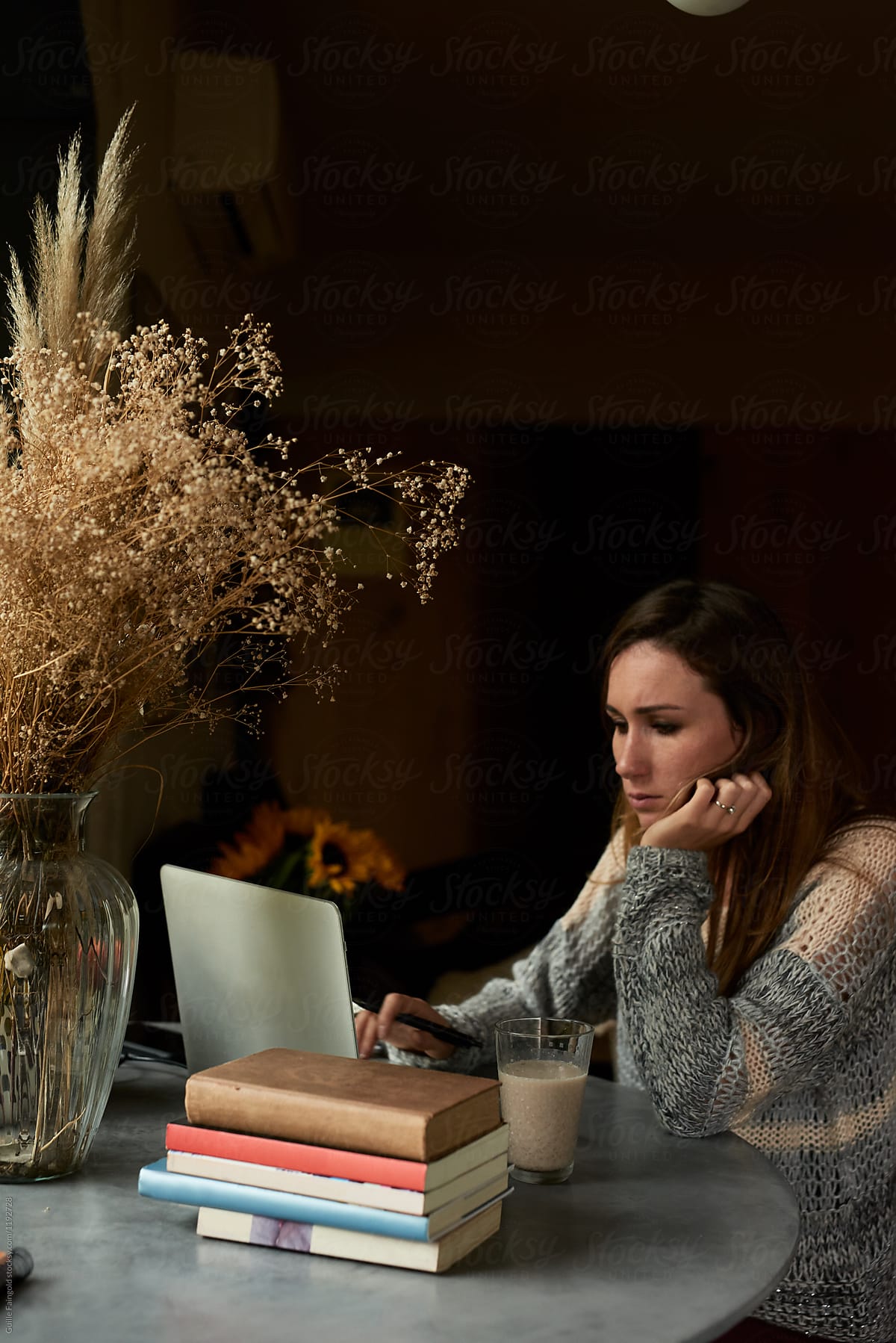 Concentrated woman working on laptop