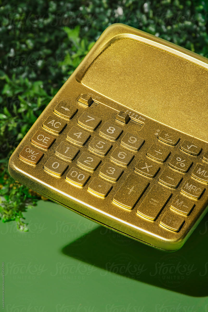 Golden calculator on green