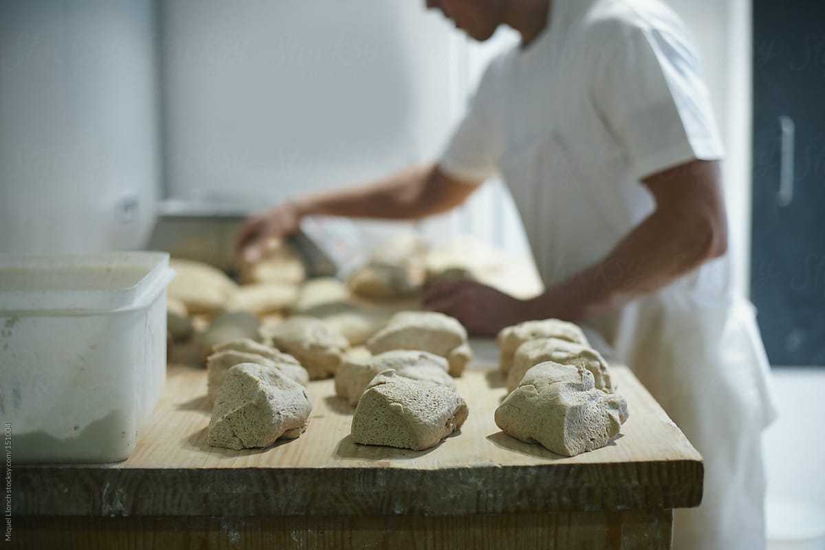 Baker preparing the dough for the bread making
