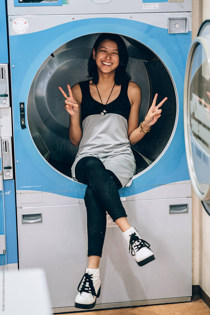 Young Asian Woman Having Fun Inside A Huge Washing Machine Del 