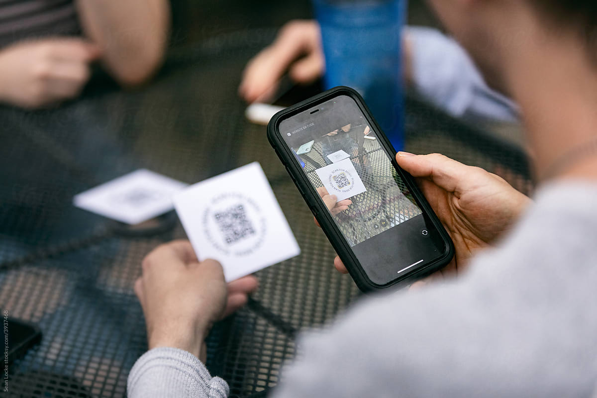 Dining: Customers Scanning Menu QR Code On Smart Phone