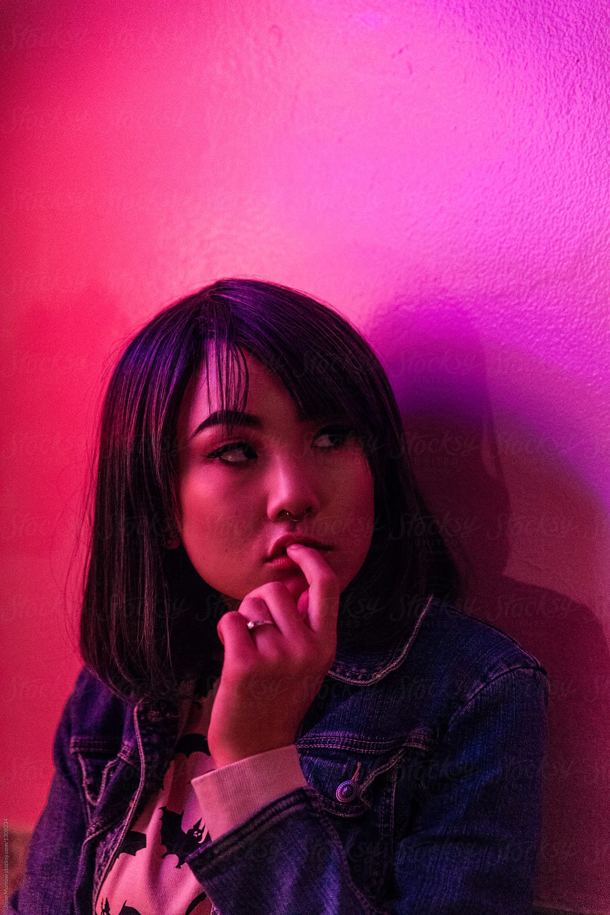 Portrait Of Young Asian Female Woman In Pink Room With Neon Lights By