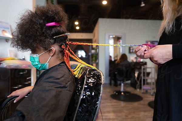 Girl Learns To Braid Hair On Black Mannequin Head by Stocksy Contributor  Jennifer Bogle - Stocksy
