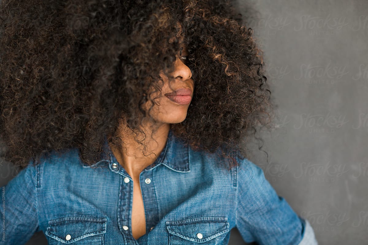 African American Woman With Big Curly Hair In Closeup