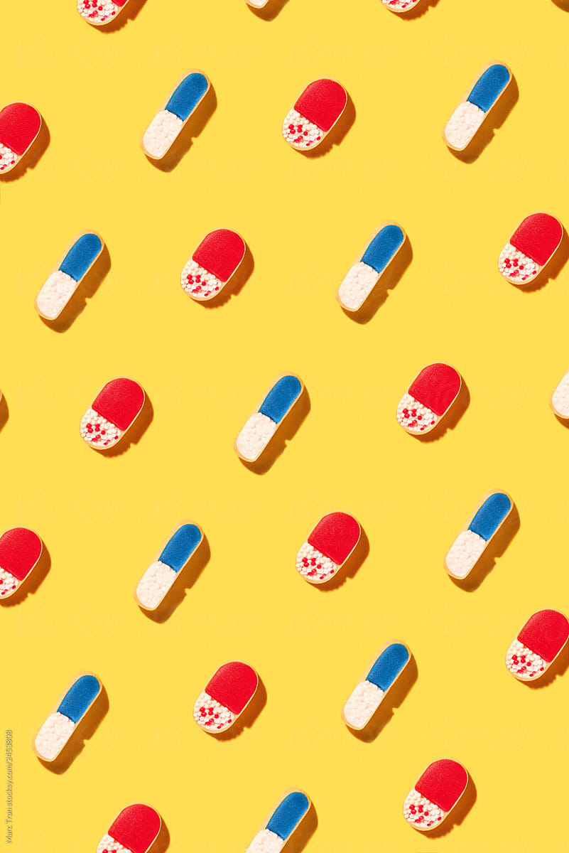 Pills on yellow background.