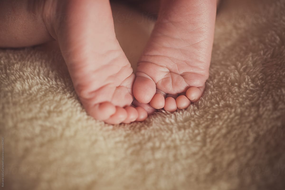 Close-up of newborns toes and feet