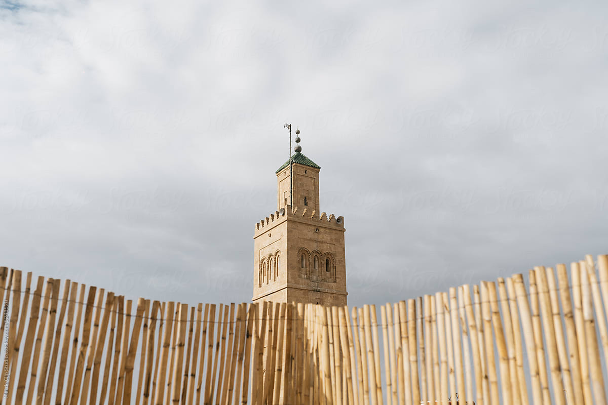 Arabic tower behind a fence