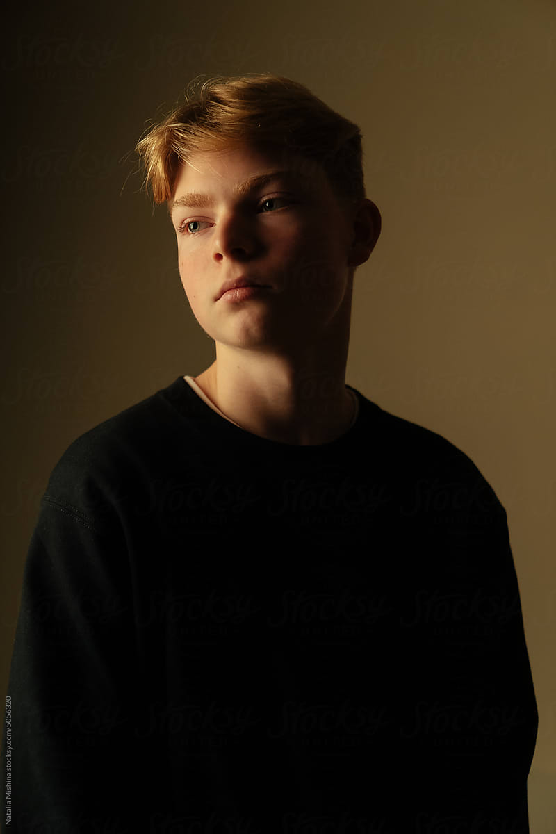 Portrait of a teenage boy with blond hair