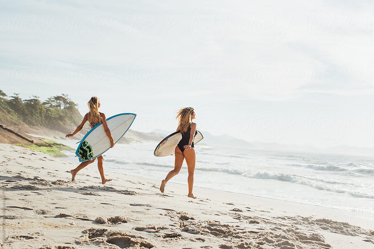Rio De Janeiro Two Sexy Female Surfer Girls Running Towards Ocean With Surfboard Under Arm 5261