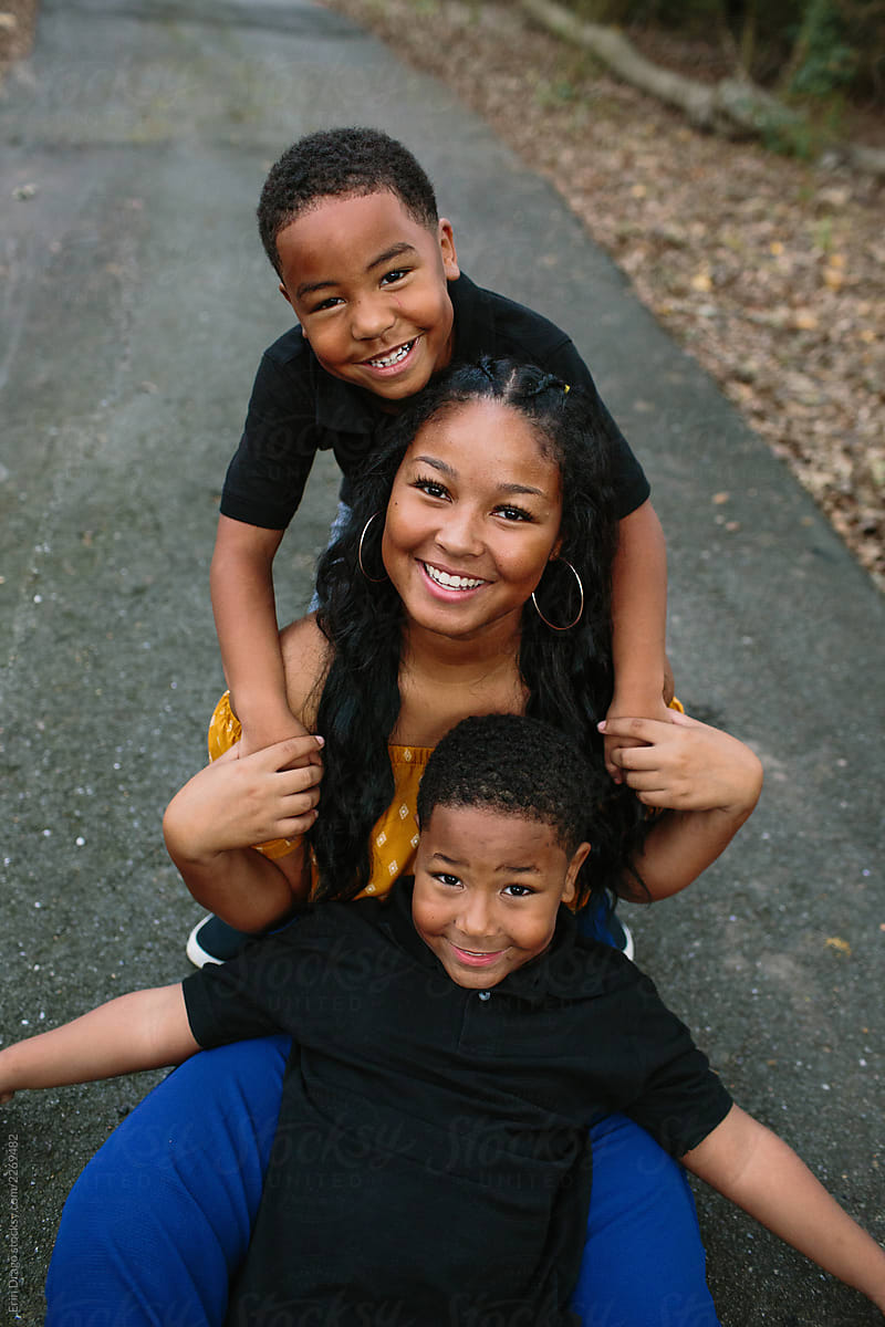Teenage Sister With Two Young Brothers