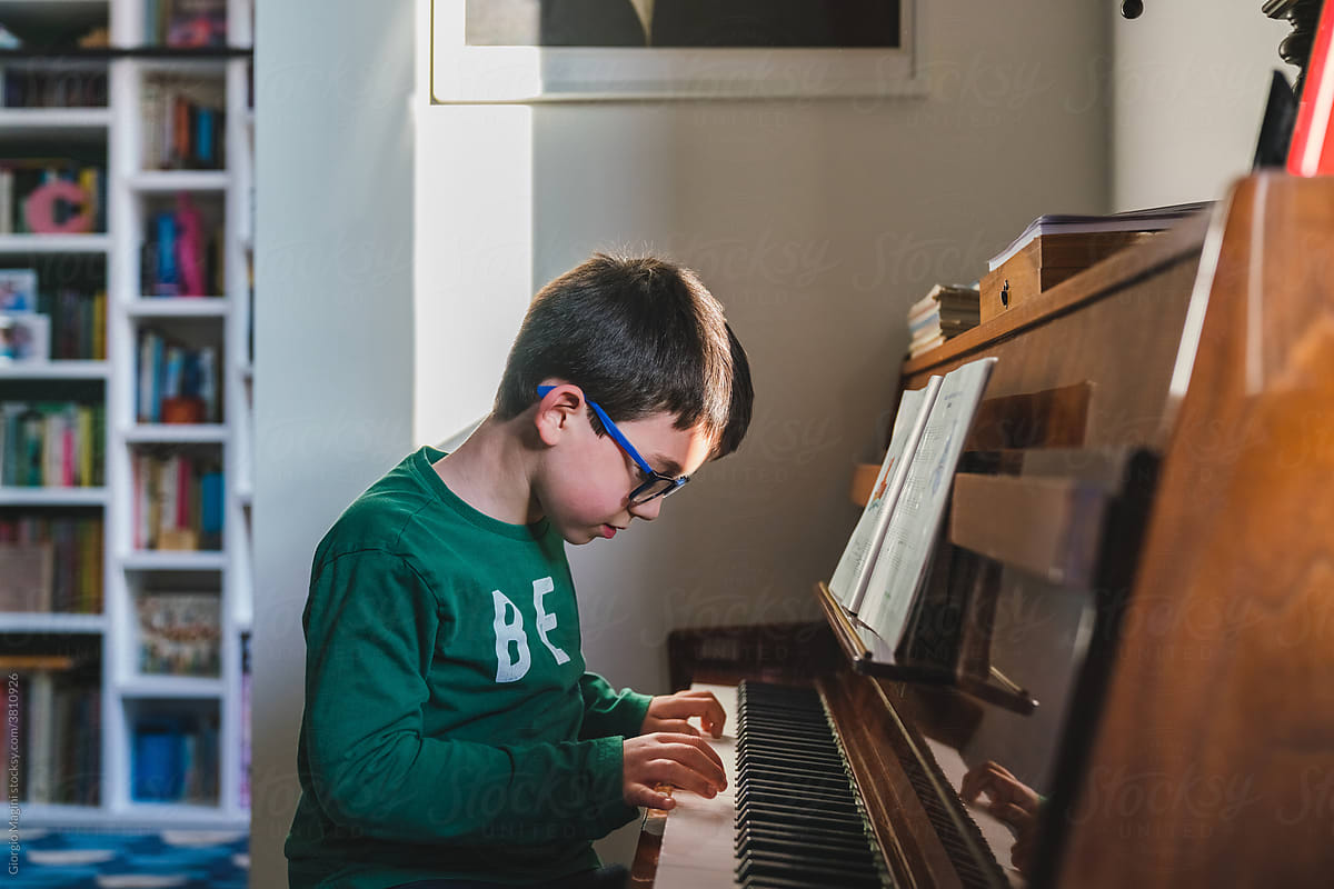 Kid Concentrated in Playing Piano