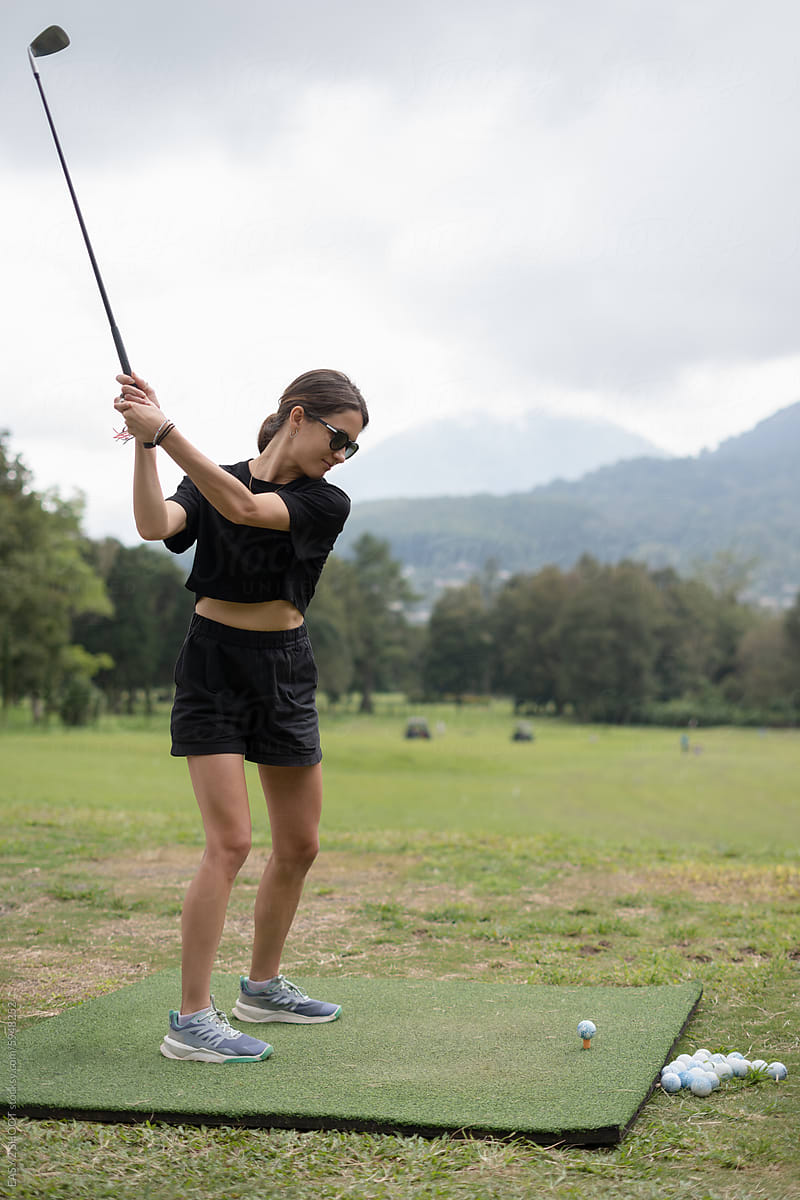 Woman Golfing With Golf Club